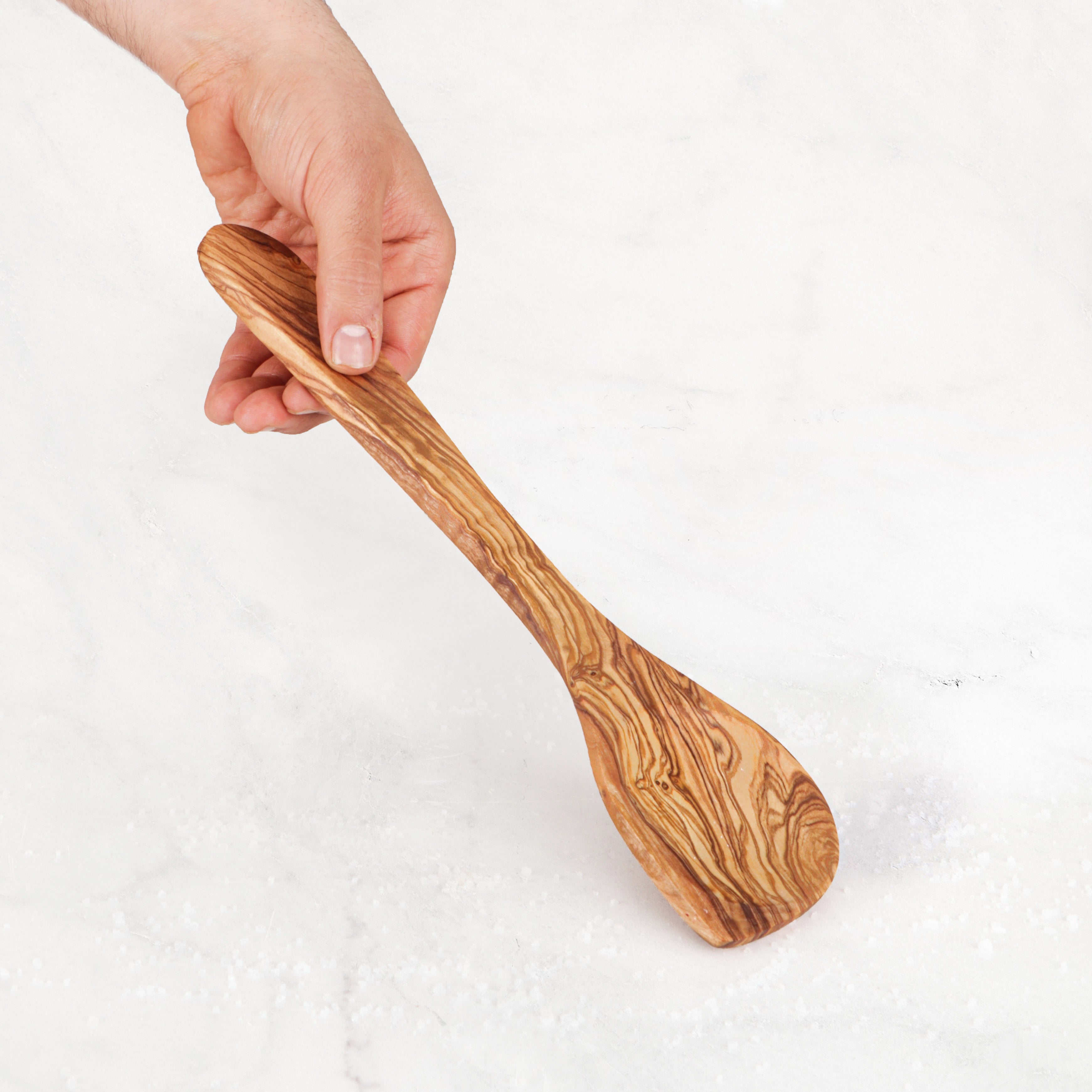 Handmade Olive Wood Corner Spoon: A durable and artistically carved wooden spoon for cooking, perfect for stirring and reaching into corners. Unique grain patterns add rustic charm to your kitchen utensils collection, combining beauty with practicality.